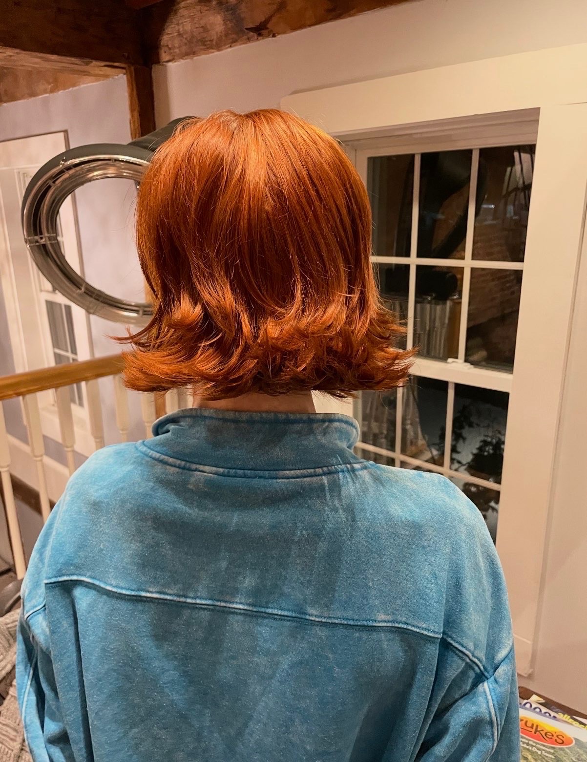 Back view of the same copper bob showing layered movement through the ends.