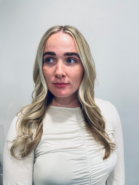 Front view of the same bright blonde with lighter face-framing pieces.