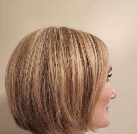 Side view of the same honey-blonde bob, angled slightly longer toward the face.