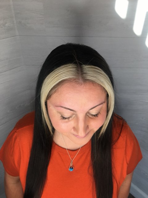 Front view of the same black hair with bold platinum pieces framing the face.